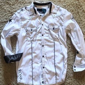 Buckle: White button down shirt /black crosses.